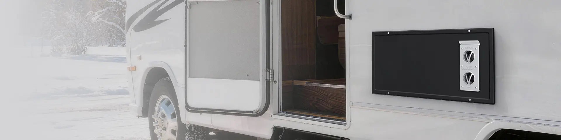 Fogatti RV furnace exterior panel installed on a motorhome during winter camping