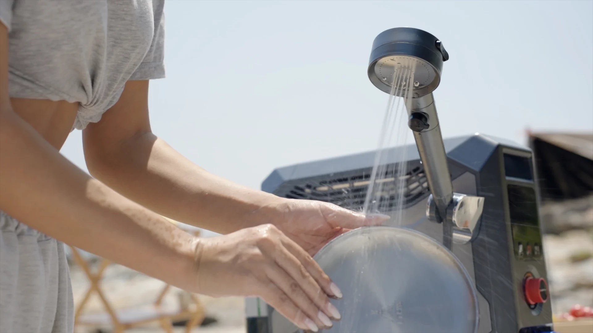 Portable Fogatti camp heater with instant hot water ideal for washing dishes at remote locations.
